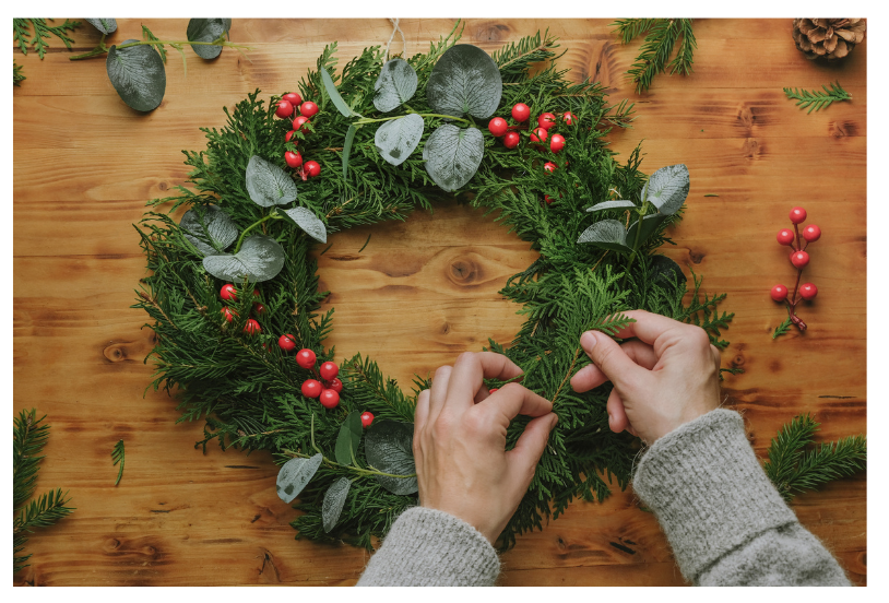 hands making a fresh wreath