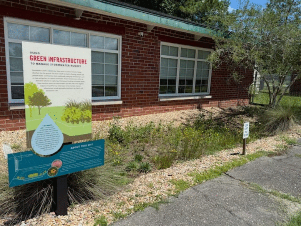 bioretention cell with sign at office garden