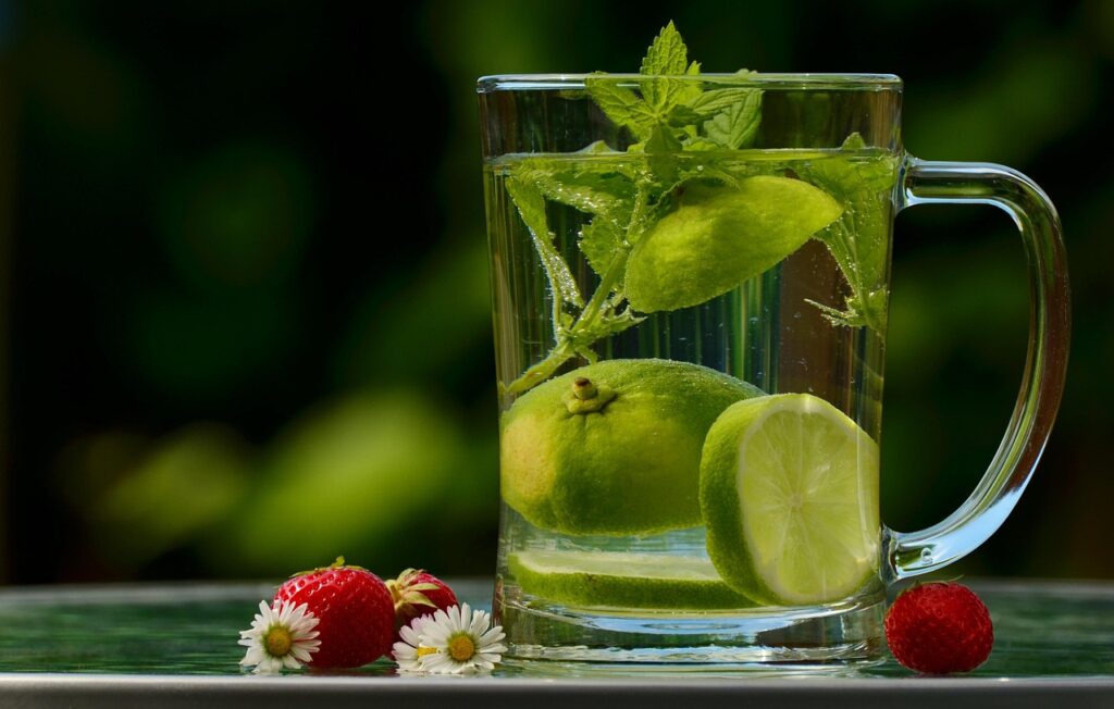 Glass-pitcher-with-fruit-and-water