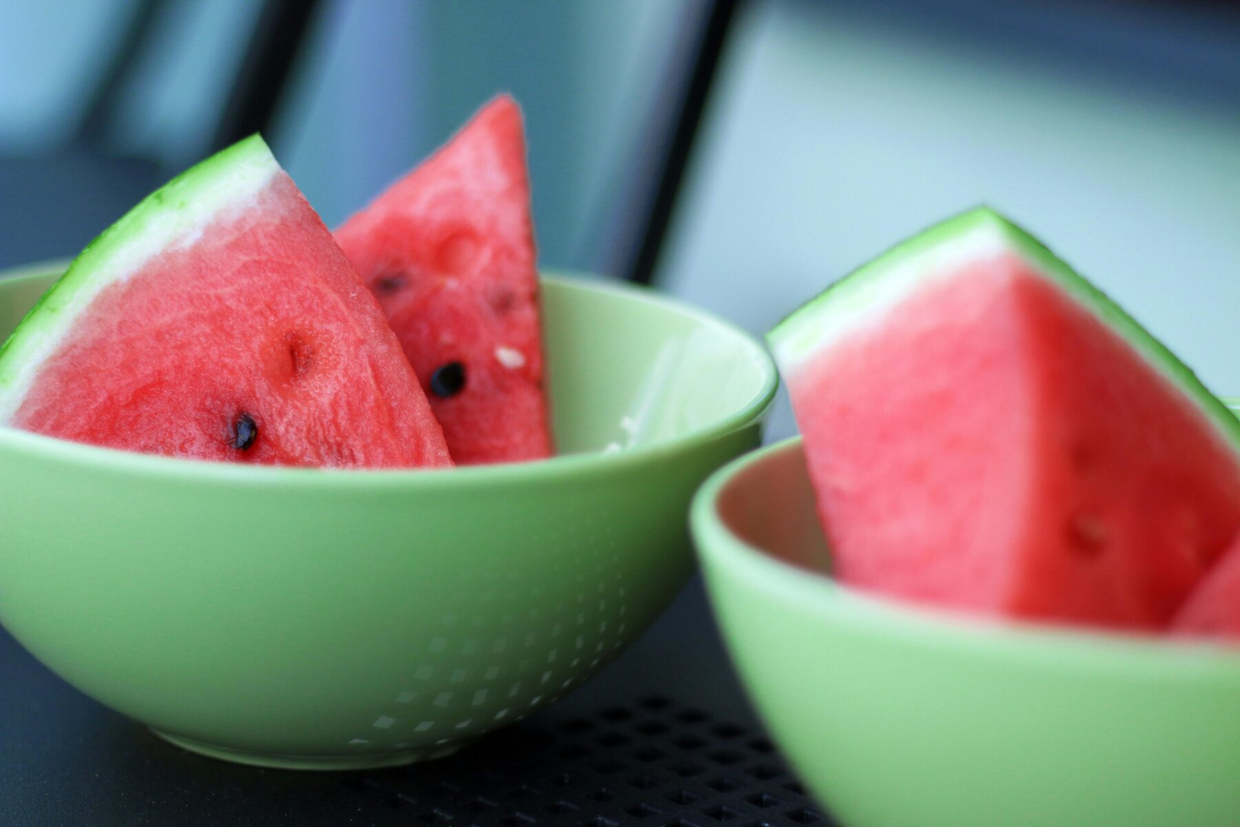 Watermelon slices in green bowls