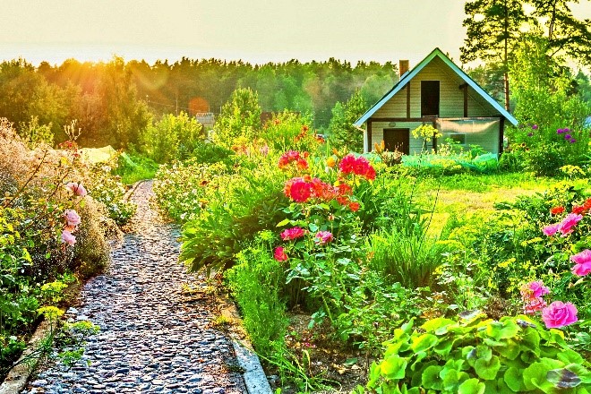 Country cottage surrounded by diverse landscape