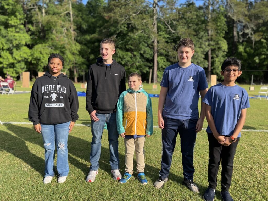 5 youth pose for a picture