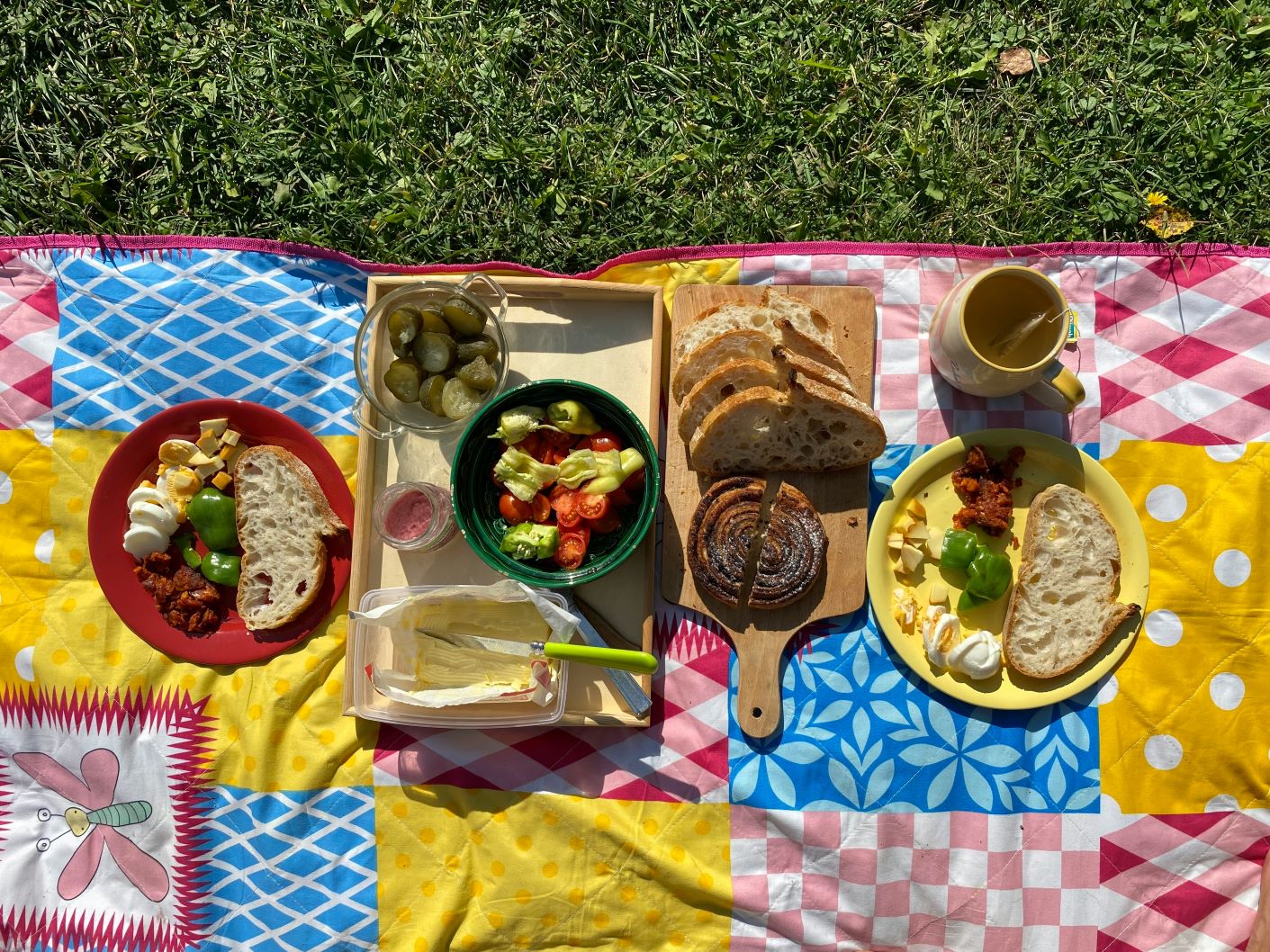 Colorful quilt with picnic items. Photo taken by Oliver Olah.