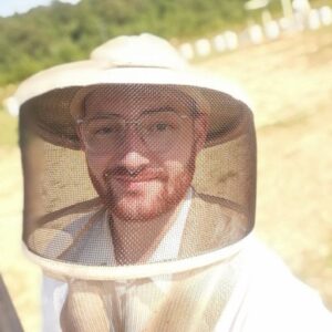 A man in a bee-keepers suit