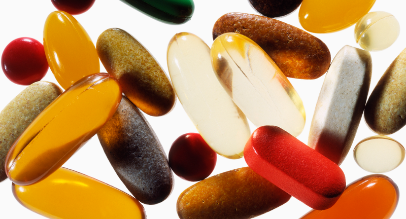 An extreme close-up of a variety of pills