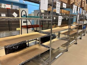 Photos with empty shelves and empty cooler – Empty shelves and coolers at food pantries are visual indicators of the food shortage