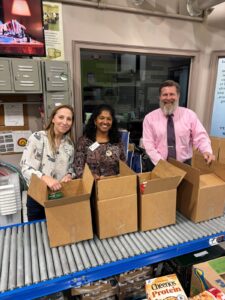 3. Two ladies and gentleman packing boxes – Gwen Hawn, FACS Agent, Hall County, Roshan Ramlal, FACS Agent, Forsyth County, and Phil Dennis, Development Director, Georgia Mountain Food Bank