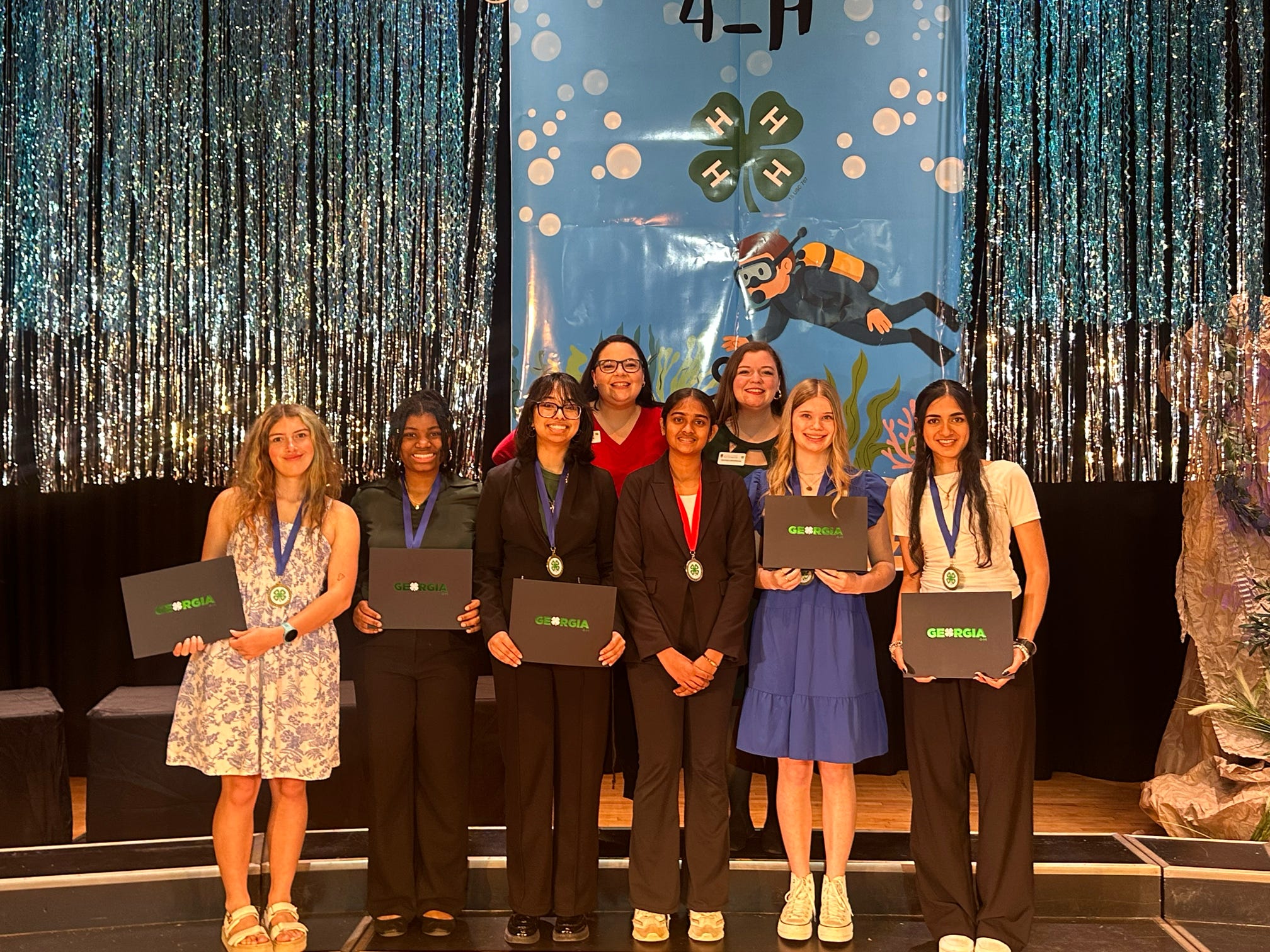 Forsyth County’s State Congress delegates on the stage at Rock Eagle 4-H Center