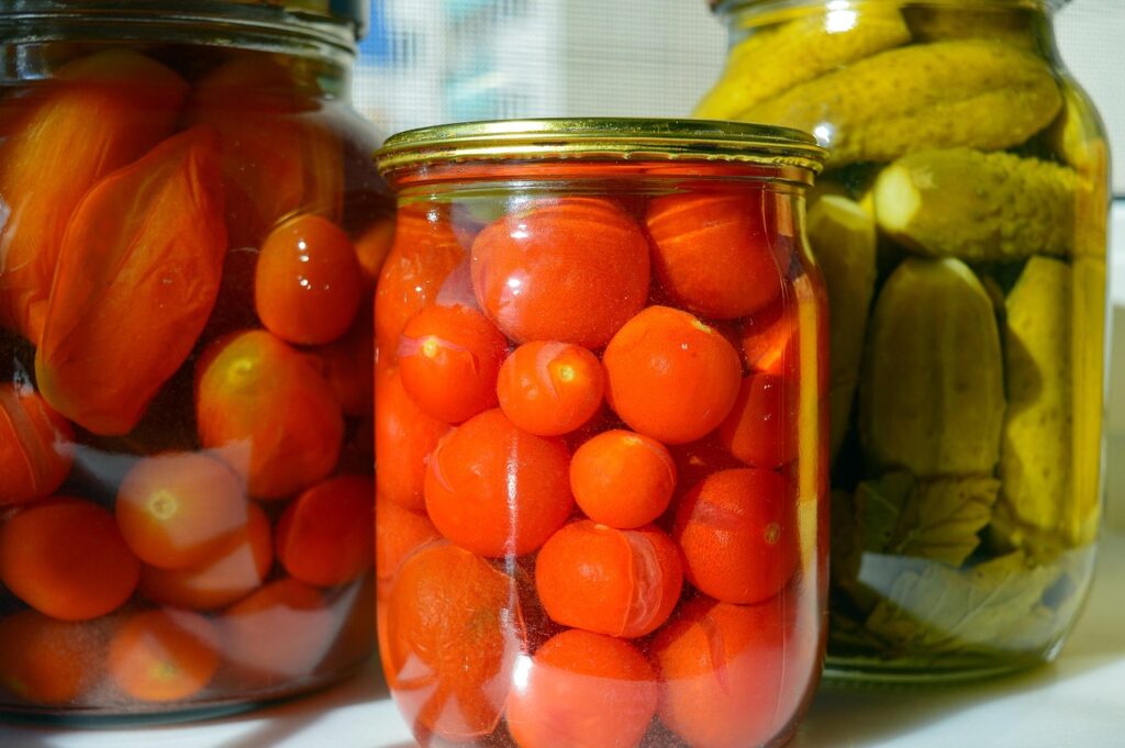 jars of preserved tomatoes and pickles