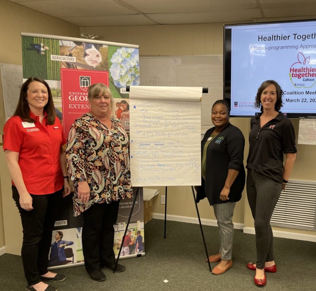 Three UGA staff members and one UGA faculty member at the Calhoun County evaluation meeting