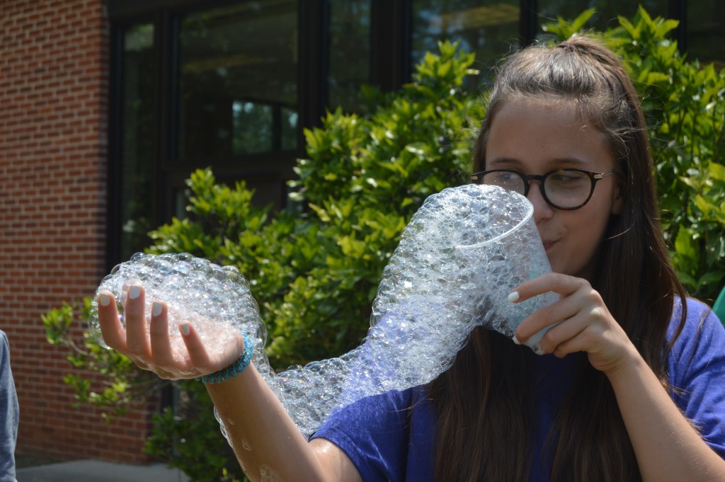 Youth creating bubbles.