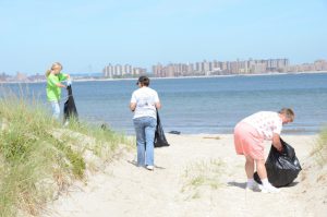 Pick up trash on beach