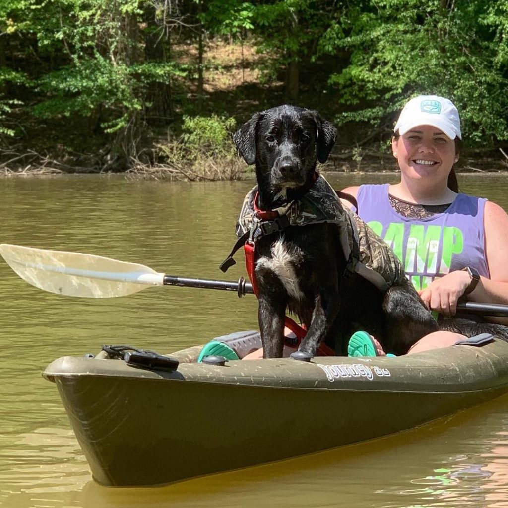 Christina Garner kayaking with her dog