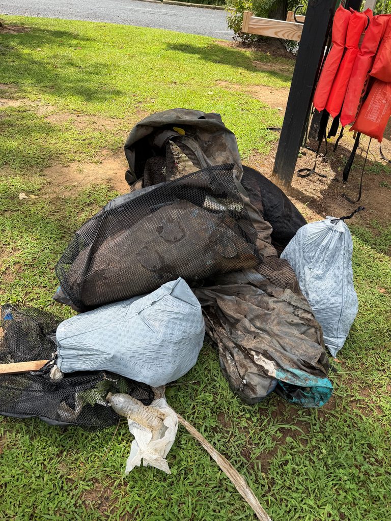pile of trash removed by 2 volunteers