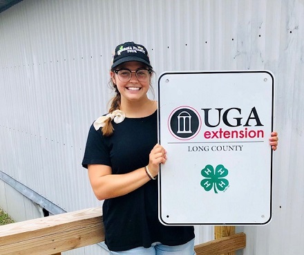 Shelby holding UGA sign