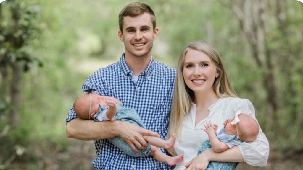 Travis with his wife, Rachel, and twin daughters, Lillian and Conley Jane.