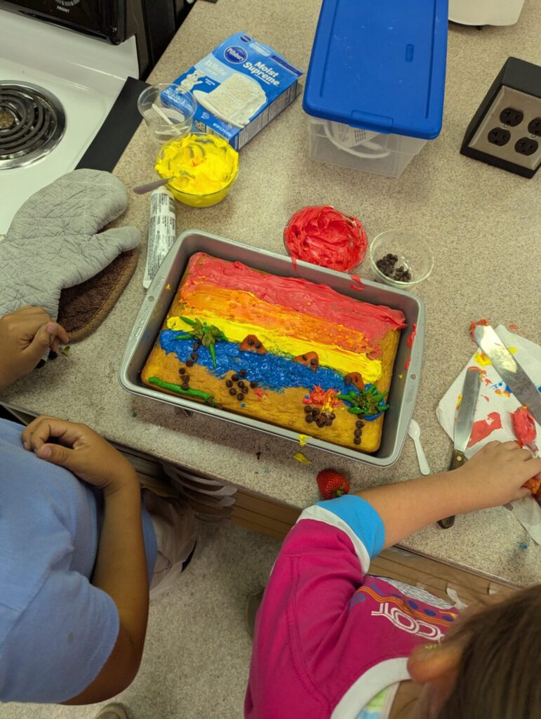 cake decorated like a sunset on a beach