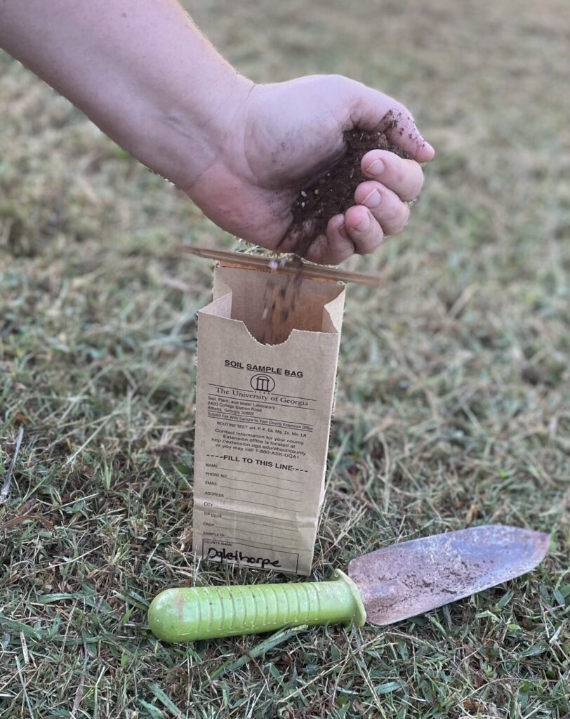 Adding soil to soil sample bag