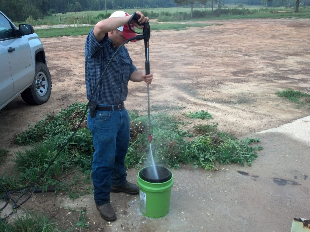 Tattnall County Extension Agent Billy Griffin pod-blasting peanuts. 